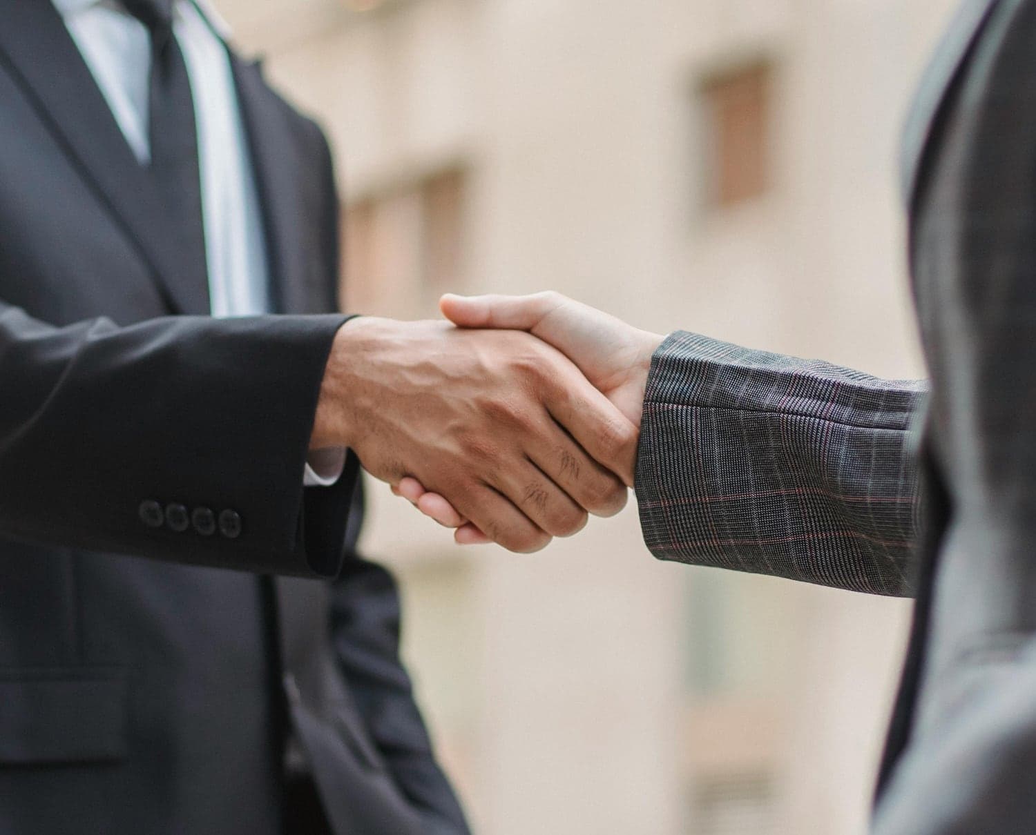 Two business partners shaking hands